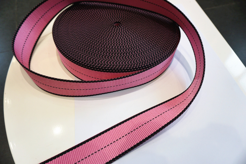 Fall arrest safety harness webbing